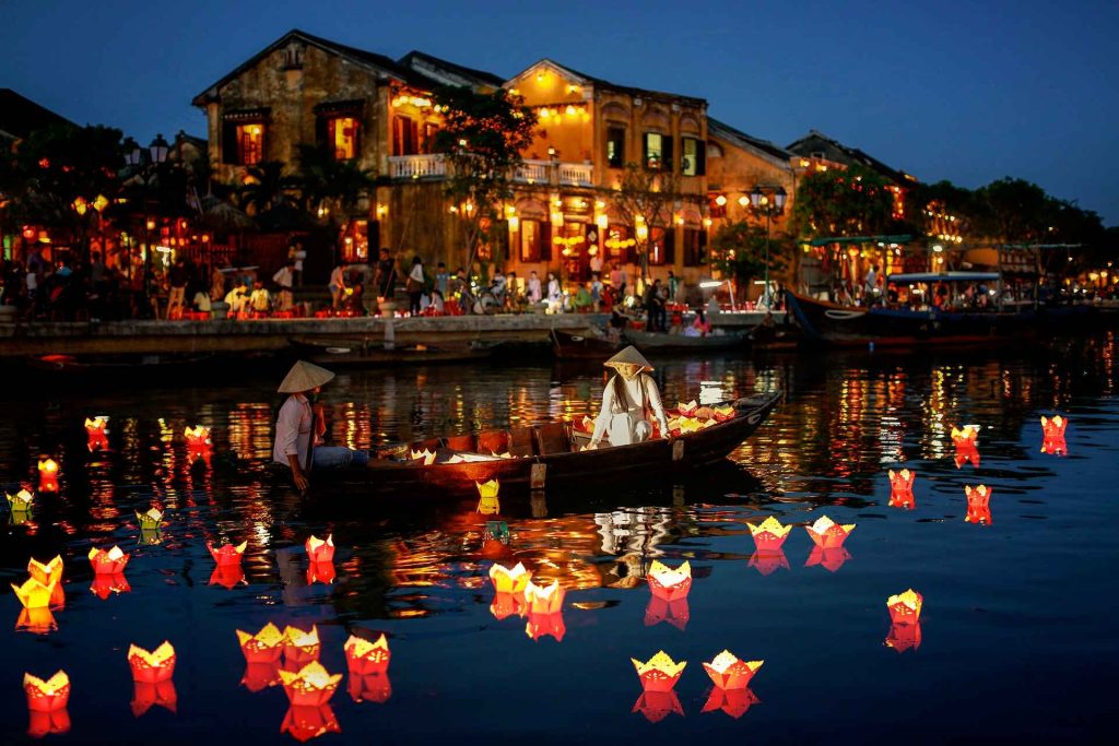 Serene scene of comfort and relaxation in Vietnam, featuring a cozy spa setting with soft lighting, bamboo decor, and tranquil surroundings. A person enjoys a soothing massage while overlooking lush rice paddies or peaceful beaches, capturing the essence of relaxation with traditional Vietnamese hospitality and natural beauty.