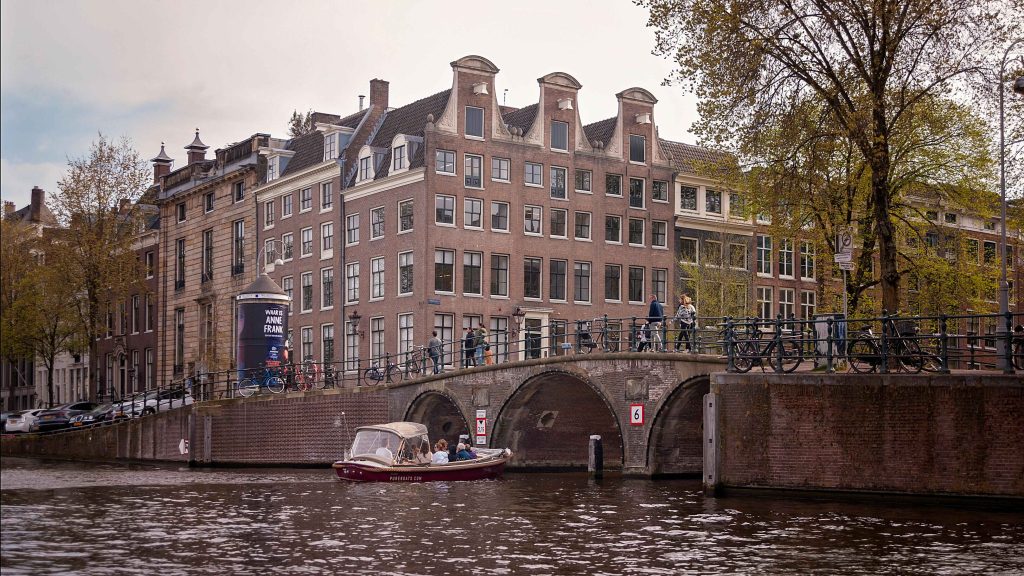 Exterior view of the Anne Frank House building in Amsterdam, located along the Prinsengracht canal.